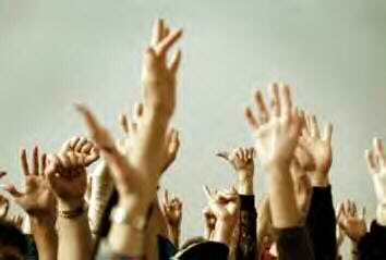 volunteers raising hands